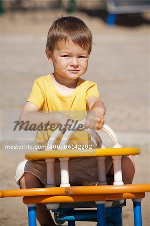 boy toddler is having fun in the playground