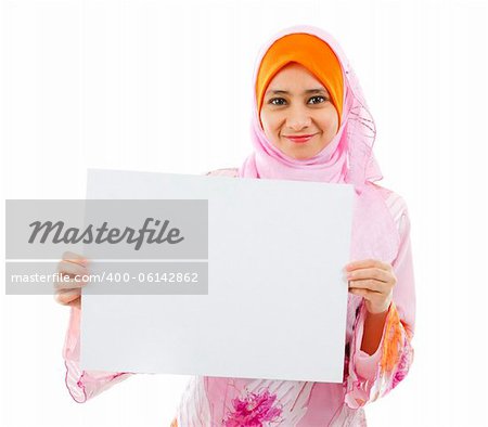 Beautiful Young Muslim girl holding a white card board over white background