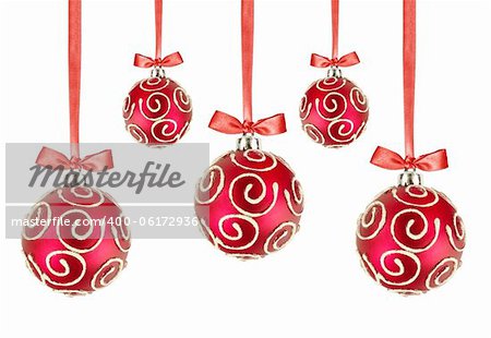 Red Christmas balls with bows on white background