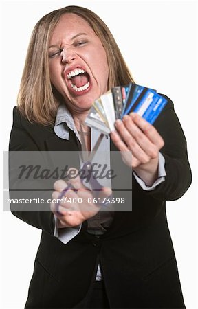 Lady with scissors and credit cards over white background