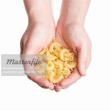 Cupped hands with pasta isolated on white