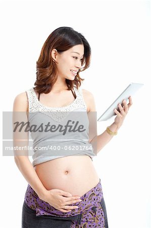 pregnant woman using the tablet pc