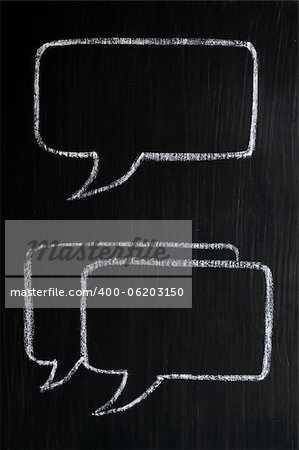 Chalk drawing of speech bubbles on a blackboard