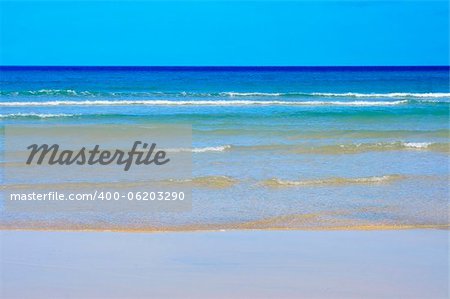closeup of a relaxing tropical blue beach