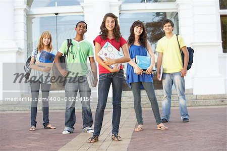 Group Of Teenage Students Standing Outside College Building