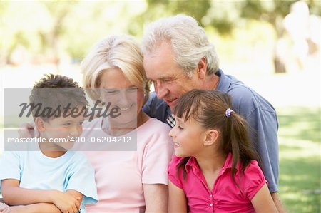 Grandparents And Grandchildren Enjoying Day In Park