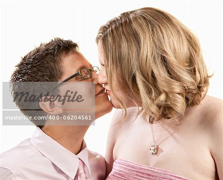 Kissing female couple close up over white