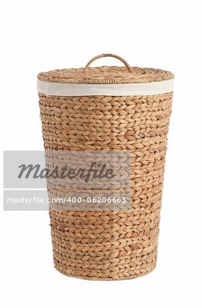 Isolated on white laundry basket made of rattan