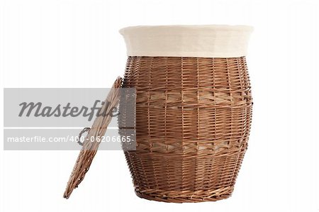 Isolated on white laundry basket made of rattan