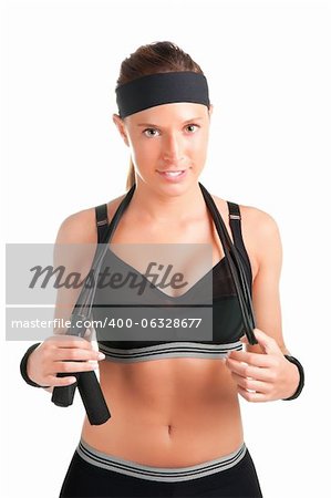 Woman with a jumping rope by her shoulders, about to start working out, isolated on a white background