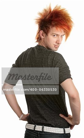 Young man with orange mohawk looking over his shoulder