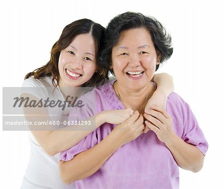 Happy Asian senior mother and adult daughter over white background