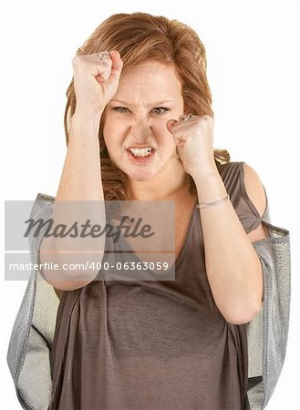 Aggressive woman with fists up on isolated background