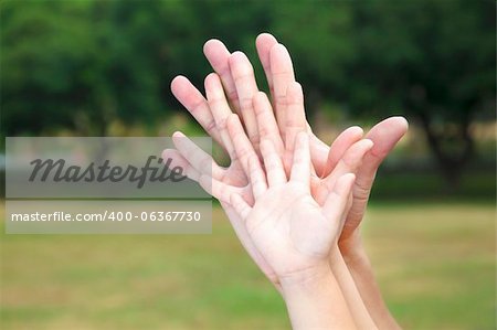 all family's hands together