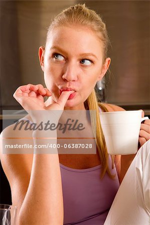 woman at home having breakfast