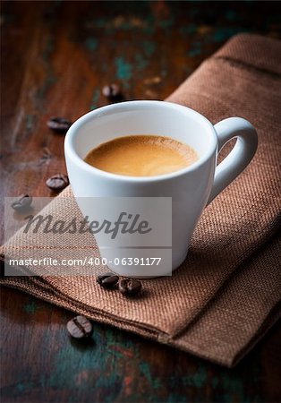 cup of espresso on brown napkin