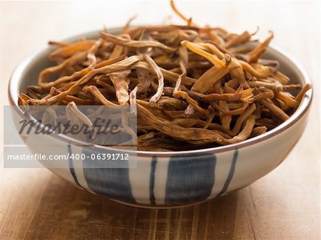 close up of a bowl of dried daylily on table