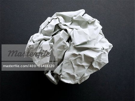 The white paper ball on a black background