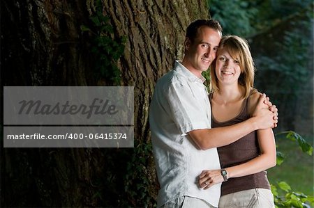 Two beautiful couple man and woman hugging each other in love