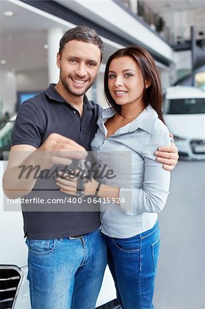Couple with the keys to car
