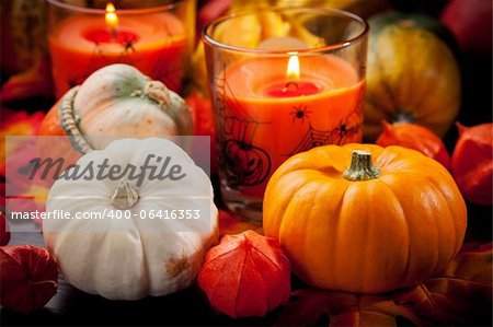 Happy Halloween - pumpkins and candles still life