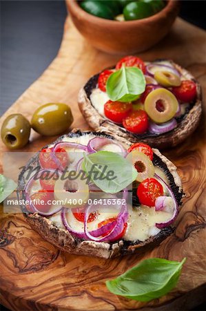 Giant Portobello mushrooms stuffed with mozzarella and tomatoes