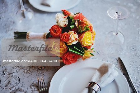 wedding bouquet on a served table in restaurant
