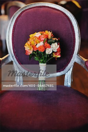 wedding bouquet on an antique armchair
