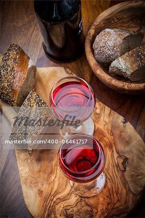 Two glasses of red wine with bread