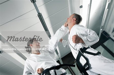 An image of a woman and a man fighting