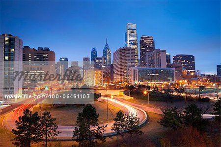 Image of Philadelphia skyline and busy roads during twilight blue hour.