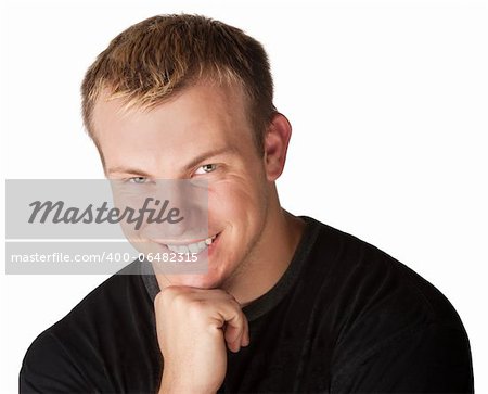 Fit young handsome man with smile and hand on chin