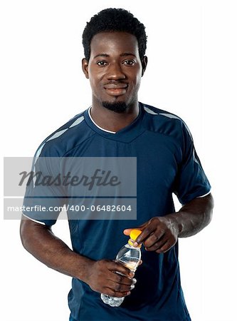 Fit man posing with water bottle isolated over white background
