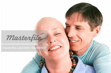 Female cancer survivor posing with ther loving husband.