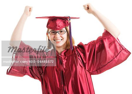 Female graduate in her cap and gown, raising her arms in a gesture of success.  Isolated on white.