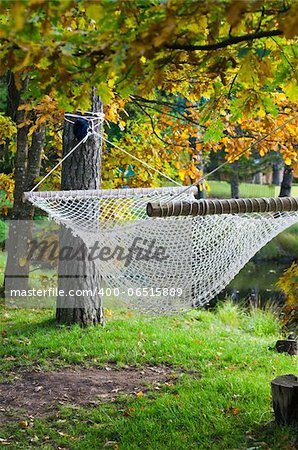 A hammock near the pond in autumn Park