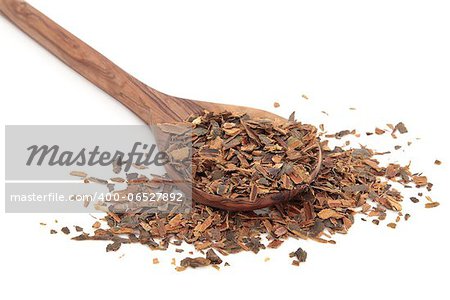 Buckthorn herb bark in an olive wood spoon over white background.