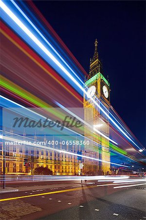 Big Ben in the evening. Dabldekker passes and leaves a line of light at slow shutter speeds. Photo taken tilt-shift lens, vertically stored