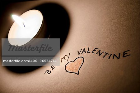 Be my Valentine note by the candle light. A nice Valentine concept.