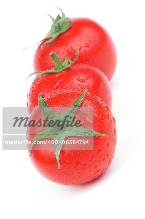 Three Perfect Raw Tomatoes with Stems and Droplets in a Row isolated on white background