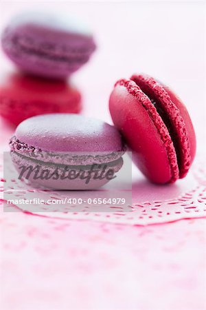 Closeup of sweet macaroons on pink mat