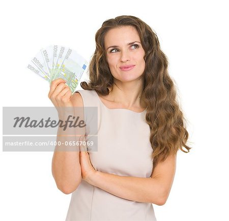 Thoughtful young woman holding fun of euro banknotes