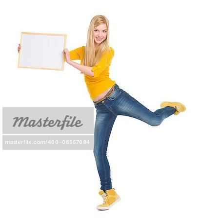 Full length portrait of happy student girl showing blank board