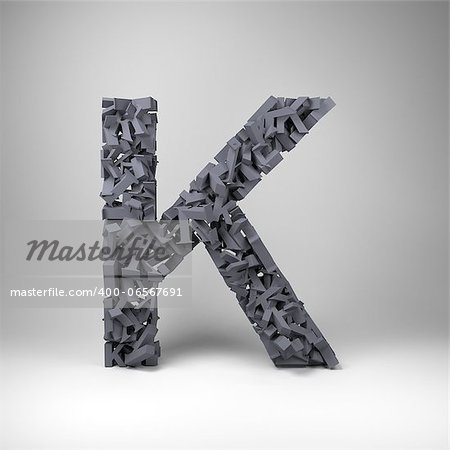 Letter K made out of scrambled small letters in studio setting Letter K made out of scrambled small letters in studio setting