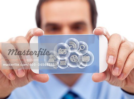 Businessman with smartphone or modern gadget accessing cloud computing applications
