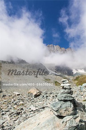 Italy, Monviso mountain. A path sign close to the top of one of the most scenic mountain of Alps.