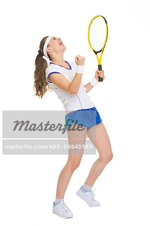 Full length portrait of happy tennis player rejoicing in success