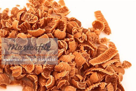 Chocolate shavings against a white background
