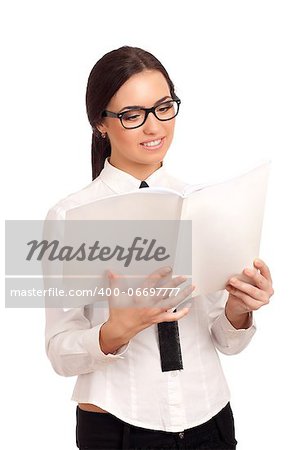 Portrait of young woman reading magazine. Shot over white background