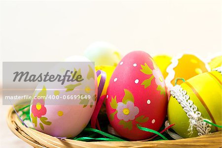 Colorful easter eggs in basket